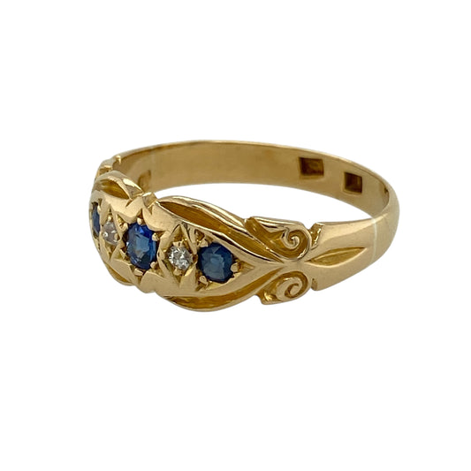 Bring classic charm and vintage appeal to your jewellery collection with this pre-owned 18ct yellow gold diamond and sapphire ring, offering elegant colour contrast and timeless sophisticationβperfect for those who appreciate refined, traditional design.
Design: This vintage-style ring features a round sapphire at the centre measuring approximately 3mm in diameter, complemented by diamond accents that enhance the rich blue hue and add a subtle yet eye-catching brilliance.