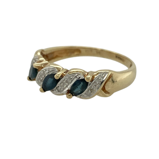 Add elegant colour and refined sparkle to your jewellery collection with this pre-owned 9ct yellow gold diamond and sapphire band ring, offering a timeless design with classic gemstone contrast.
Design: This band ring features a front measuring approximately 5mm in width, showcasing three marquise-shaped sapphires arranged across the band, with small diamonds positioned between them for added sparkle and balance.