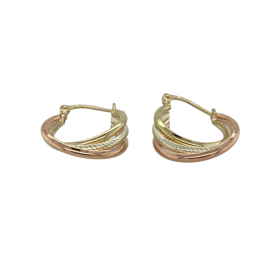 Add versatile elegance to your jewellery collection with these pre-owned 9ct yellow, white and rose gold twisted hoop creole earrings, combining three-tone styling with timeless appeal. A beautiful pair perfect for everyday wear or effortless accessorising.
Design: The earrings feature a classic hoop creole silhouette enhanced by an intertwined twisted design. The flowing strands of yellow, white and rose gold create depth and subtle contrast, offering eye-catching dimension with a refined finish.