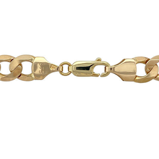 Make a bold statement with this pre-owned 9ct yellow gold 20" curb chain, a substantial and eye-catching piece perfect for those who appreciate strong, classic gold jewellery.
Design: This chain features traditional flat curb links measuring approximately 8mm in width, creating a powerful and structured profile. The closely interlocking links lie smoothly against the skin, offering a clean, masculine finish with excellent light reflection.