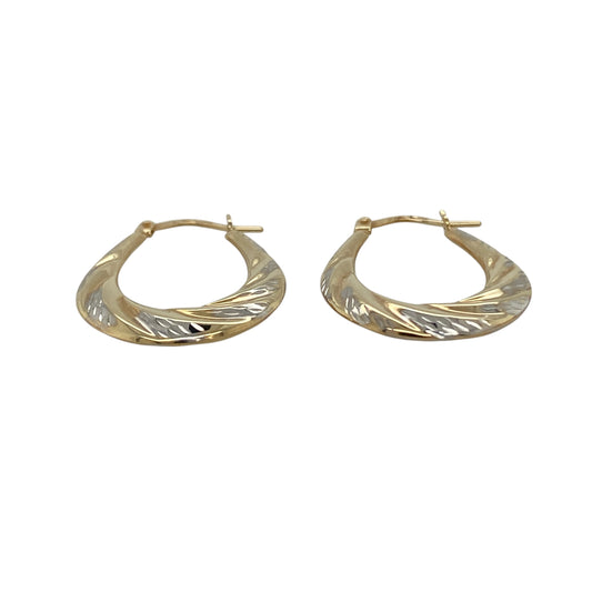 Add a touch of modern elegance to your jewellery collection with these pre-owned 9ct yellow and white gold twisted oval creole earrings—an effortless blend of classic shape and contemporary detail.
Design: The oval creole silhouette is enhanced by a delicate twisted design, creating subtle texture and light-catching movement. The intertwining effect gives the earrings added dimension while maintaining a refined and wearable profile.