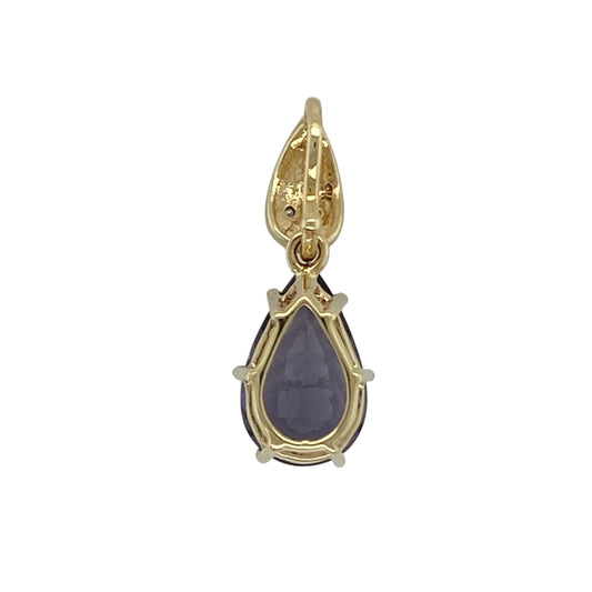 Add vibrant colour and elegant sparkle to your jewellery collection with this pre-owned 9ct yellow gold diamond and purple stone set pendant—an eye-catching statement piece perfect for special occasions or dressing up everyday looks.
Design: The pendant features a striking tanzanite coloured teardrop stone measuring approximately 13mm by 18mm, offering rich purple-blue tones and a graceful drop silhouette.