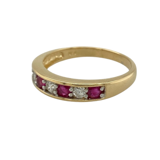 Add vibrant colour and timeless sparkle to your jewellery collection with this pre-owned 18ct yellow gold diamond and ruby set band ring, combining rich gemstones with classic gold styling—perfect as an anniversary ring or elegant statement band.
Design: The front of the band measures approximately 4mm wide and features a striking combination of diamonds and rubies arranged across the centre.