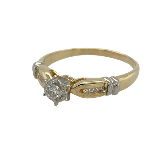Add classic sparkle to your jewellery collection with this pre-owned 10ct yellow gold diamond illusion set solitaire ring, featuring a timeless design that enhances the brilliance of the centre stone—perfect for everyday elegance or as a meaningful gift.
Design: The ring showcases a single diamond at the centre in an illusion style setting, designed to enhance the appearance and sparkle of the stone. The diamond has an approximate weight of 0.11ct, creating a delicate yet eye-catching focal point.