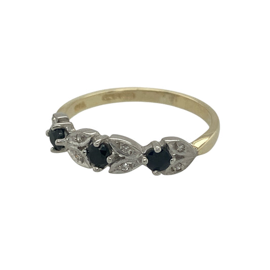 Add timeless colour and delicate sparkle to your jewellery collection with this pre-owned 9ct yellow gold diamond and sapphire band ring, featuring a classic gemstone combination—perfect for everyday wear or stacking with other rings.
Design: The band features alternating sapphires and sparkling diamonds across the front, creating a balanced display of deep blue colour and brilliance. The sapphires measure approximately 2mm, adding subtle yet eye-catching detail to the design.