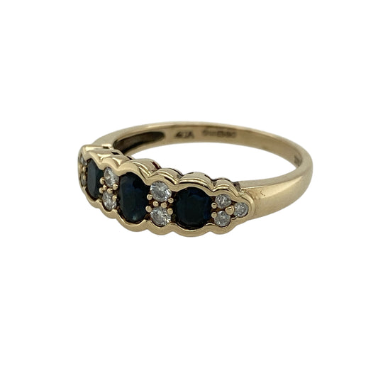 Add a touch of timeless elegance to your jewellery collection with this pre-owned 9ct yellow gold diamond and sapphire set trilogy cluster band ring, combining rich colour with classic sparkle—perfect for everyday wear or special occasions.
Design: The ring features a trilogy-style cluster design, with three oval sapphires accented by diamonds at the centre, creating a balanced and eye-catching arrangement.