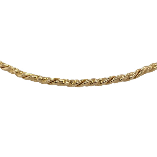 Add a touch of subtle texture to your jewellery collection with this pre-owned 9ct yellow gold twisted bangle, offering a timeless design with a refined finishβperfect for everyday wear or stacking.
Design: The bangle features a slim twisted design, creating a delicate and light-catching effect that adds gentle detail to a classic shape.
Material: Made from 9-carat yellow gold, it has a polished finish that enhances its warm tone and highlights the twisted pattern.