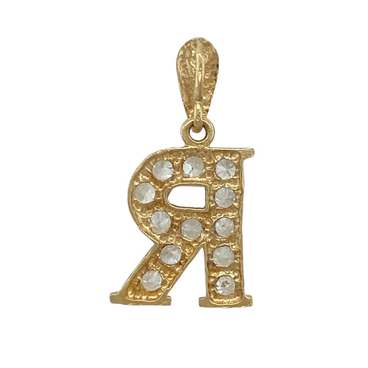 Add a personalised and stylish touch to your jewellery collection with this pre-owned 9ct yellow and white gold cubic zirconia set initial ‘R’ pendant, combining meaningful detail with eye-catching sparkle—perfect for everyday wear or gifting.
Design: The pendant features a bold initial ‘R’ design, accented with cubic zirconia stones that add a bright and decorative sparkle.
Material: Made from 9-carat yellow and white gold, the two-tone finish enhances the design and adds contrast and visual interest.