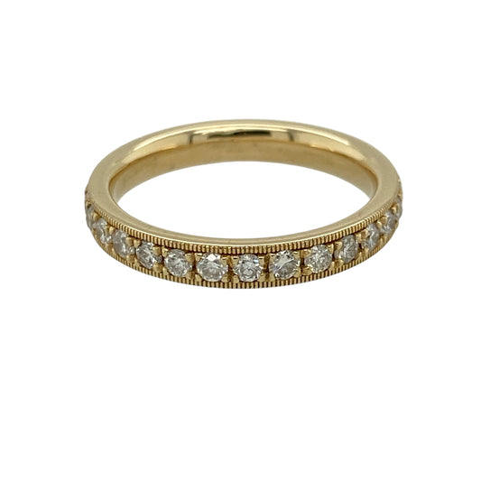 Add timeless elegance and continuous sparkle to your jewellery collection with this pre-owned 18ct yellow gold diamond set eternity milgrain edge style band ring—an exquisite piece perfect for special occasions or everyday luxury.
Design: This eternity band features a slim 3mm profile with diamonds set all the way around, enhanced by delicate milgrain edging for a refined and vintage-inspired finish.