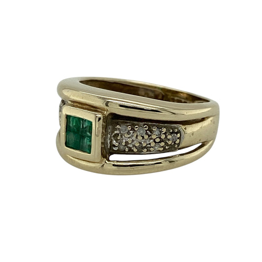 Add bold elegance and rich colour to your jewellery collection with this pre-owned 9ct yellow and white gold diamond and emerald set band ring—an eye-catching piece perfect for making a statement.
Design: This ring features a wide 10mm band with a striking centre made up of four square emeralds set together, forming a 4mm by 4mm cluster, complemented by sparkling diamonds that enhance the overall brilliance and structure of the design.