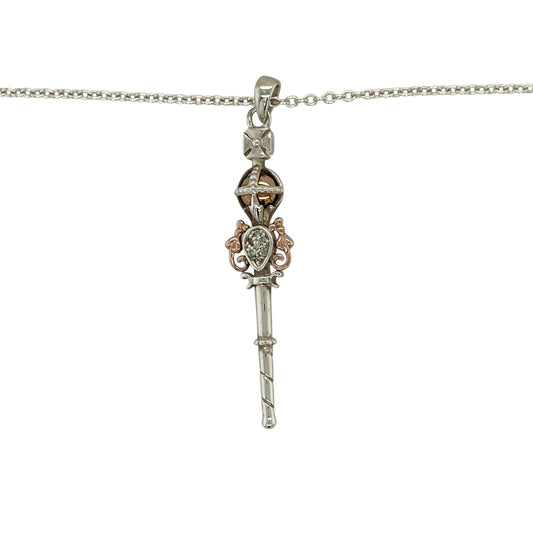 Add regal elegance and meaningful design to your jewellery collection with this pre-owned 925 silver and 9ct rose gold diamond set Clogau Jubilee Sceptre pendant necklaceβan eye-catching piece inspired by royal heritage.
Design: This necklace features a beautifully detailed Jubilee Sceptre pendant measuring approximately 5cm in length including the bail, set with sparkling diamonds that enhance its intricate and symbolic design.