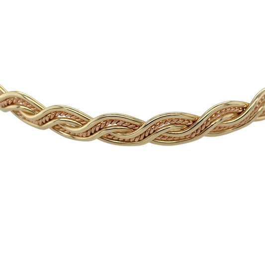Add heritage-inspired elegance to your jewellery collection with this pre-owned 9ct yellow gold Welsh Gold Cymru twist bangle, featuring a distinctive woven designβperfect for everyday wear or a standout statement piece.
Design: The bangle showcases a metal weave twist style, creating an interlaced effect that adds texture and visual depth with a refined, traditional feel.