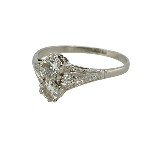 Add striking elegance to your jewellery collection with this pre-owned platinum diamond ring, featuring a unique double-stone design and impressive sparkle—perfect for special occasions or standout everyday wear.
Design: The ring showcases two brilliant-cut diamonds positioned one above the other, each approximately 0.25ct, creating a distinctive and eye-catching look.