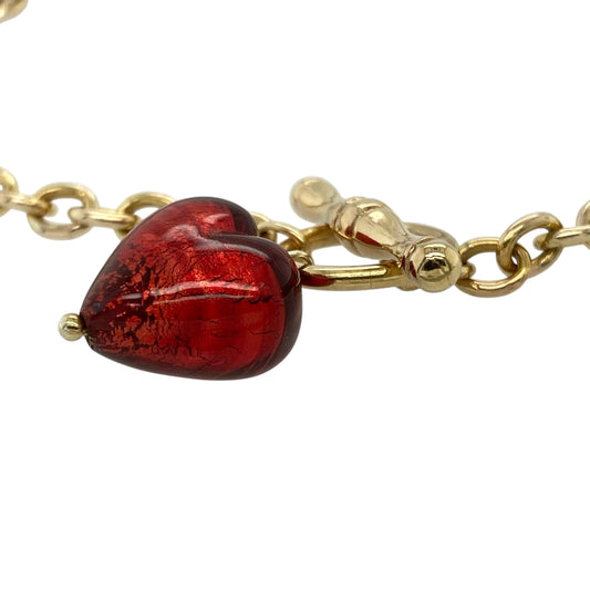 Add a romantic touch to your jewellery collection with this pre-owned 9ct yellow gold red stone heart bracelet, featuring a charming design with classic detailing—perfect for everyday wear or meaningful gifting.
Design: The bracelet features a belcher link chain with a heart-shaped red stone charm measuring approximately 12mm, creating a bold and eye-catching focal point.