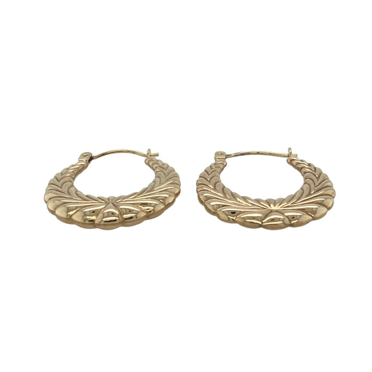 Add elegant texture and timeless style to your collection with these pre-owned 9ct yellow gold patterned textured oval creole earrings—an eye-catching pair perfect for everyday wear.
Design: The earrings feature an oval creole shape with patterned and textured detailing, creating a refined look that catches the light beautifully for added depth and shine.
Material: Made from 9-carat yellow gold, the polished finish enhances the warmth of the metal while highlighting the intricate texture.