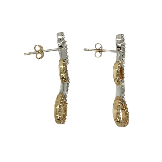 Bring elegant movement and subtle sparkle to your collection with these pre-owned 9ct yellow and white gold diamond set oval link drop earrings, featuring a stylish two-tone design and timeless appealβperfect for both everyday wear and special occasions.
Design: The earrings feature an oval link drop style, combining smooth, flowing shapes with delicate diamond accents to create a refined and eye-catching look.