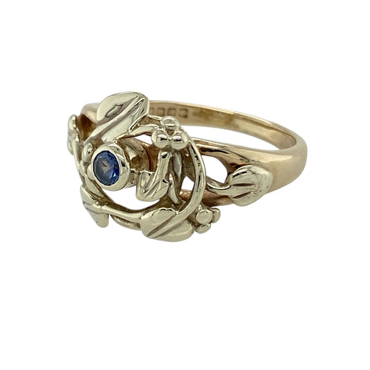 Bring meaningful symbolism and elegant colour to your collection with this pre-owned 9ct yellow and white gold Clogau Tree of Life sapphire ring, featuring a striking design with timeless Welsh charm—perfect for everyday wear or special occasions.
Design: The ring showcases the iconic Tree of Life motif across the front, measuring approximately 13mm in height, centred with a 3mm sapphire that adds a refined touch of colour and elegance.