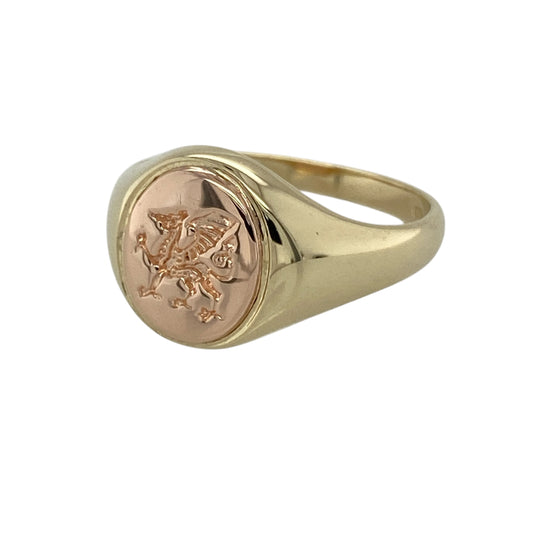Bring heritage charm and timeless style to your collection with this pre-owned 9ct Welsh gold Welsh dragon oval signet ring, featuring a bold design with meaningful symbolism—perfect for everyday wear or as a distinctive statement piece.
Design: The ring showcases an oval signet-style front measuring approximately 11mm in height, detailed with the iconic Welsh dragon motif for a striking and recognisable finish.