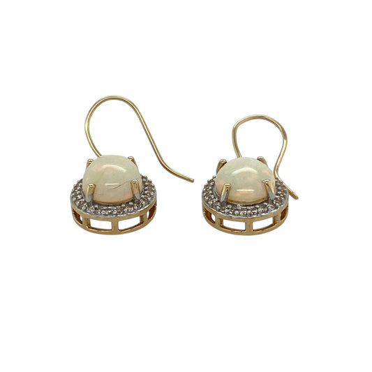 Add elegant shimmer and timeless colour to your jewellery collection with these pre-owned 9ct yellow gold opalique and cubic zirconia cluster drop earrings, featuring luminous oval stones with sparkling accents—perfect for special occasions, evening wear, or sophisticated everyday styling.
Design: The earrings feature graceful drop styling with oval opalique stones measuring approximately 9mm by 7mm each, surrounded by sparkling cubic zirconia stones in a classic cluster design for enhanced brilliance