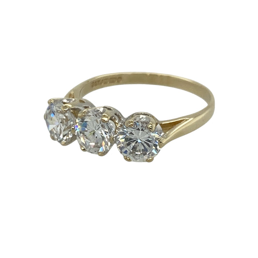 Add timeless sparkle and elegant simplicity to your jewellery collection with this pre-owned 9ct yellow gold cubic zirconia set trilogy ring, featuring a classic three-stone design with brilliant everyday appeal—perfect for special occasions, gifting, or sophisticated daily wear.
Design: The ring showcases three sparkling round cubic zirconia stones, each measuring approximately 5mm in diameter, creating a balanced and eye-catching trilogy design with beautiful light-catching brilliance.