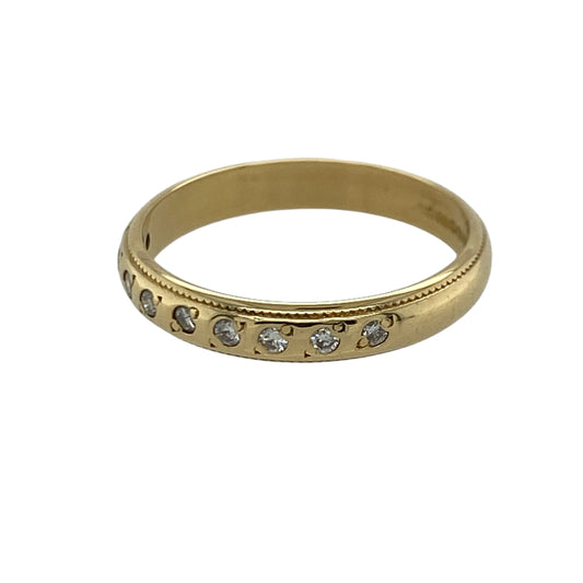 Add timeless sparkle and vintage-inspired elegance to your jewellery collection with this pre-owned 18ct yellow gold diamond set band ring, featuring delicate milgrain detailing and classic diamond brilliance—perfect for stacking, anniversaries, or sophisticated everyday wear.
Design: The ring features a refined 3mm wide band set with nine sparkling diamonds, creating a beautifully balanced and elegant look.