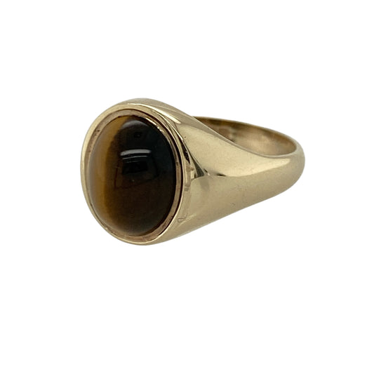 Add timeless character and vintage-inspired style to your jewellery collection with this pre-owned 9ct yellow gold tiger's eye oval signet ring, featuring a striking natural gemstone with classic statement appeal—perfect for everyday wear, gifting, or traditional jewellery styling.
Design: The ring showcases a polished oval tiger's eye stone measuring approximately 10mm by 8mm, creating a distinctive focal point with its warm golden-brown tones and natural chatoyant effect.