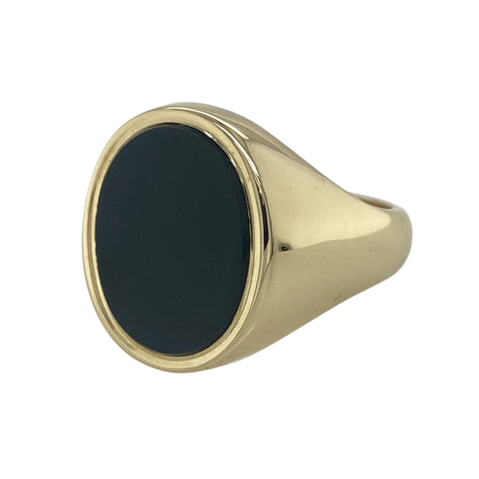 Add bold traditional style to your jewellery collection with this pre-owned 9ct yellow gold onyx oval signet ring, featuring a substantial classic design with timeless statement appeal—perfect for everyday wear, formal occasions, or collectors of heritage-inspired jewellery.
Design: The ring showcases a striking oval onyx stone measuring approximately 16mm by 12mm, creating a bold and distinguished focal point within a classic signet ring setting.
