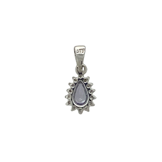 Add a touch of elegant colour and sparkle to your jewellery collection with this pre-owned 9ct white gold diamond and tanzanite teardrop cluster pendant, featuring a graceful gemstone design with timeless everyday appeal—perfect for gifting, special occasions, or refined daily wear.
Design: The pendant showcases a beautiful teardrop-shaped tanzanite measuring approximately 5mm by 3mm, surrounded by a cluster of sparkling diamonds that enhance its captivating violet-blue tones.