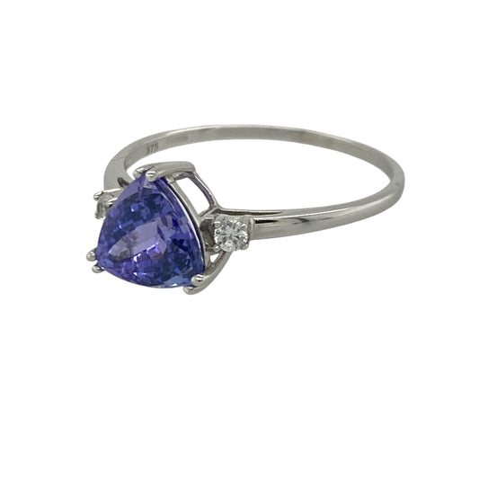 Add captivating colour and elegant sparkle to your jewellery collection with this pre-owned 9ct white gold tanzanite and cubic zirconia ring, featuring a distinctive gemstone design with sophisticated everyday appeal—perfect for special occasions, gifting, or refined daily wear.
Design: The ring showcases a beautiful triangle-cut tanzanite measuring approximately 7mm by 7mm by 7mm, creating a striking focal point with its vibrant violet-blue tones.