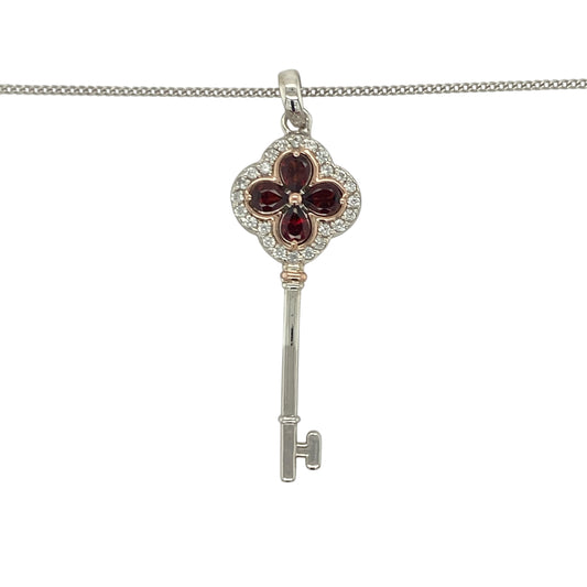 Add a touch of Welsh heritage and regal elegance to your jewellery collection with this pre-owned sterling silver, 9ct rose gold, garnet and white topaz Clogau Tudor Key pendant necklace, featuring a beautifully symbolic design with timeless appeal—perfect for gifting, special occasions, or meaningful everyday wear.
Design: The necklace features an intricately crafted Tudor Key pendant measuring approximately 4.2cm in length including the bail.