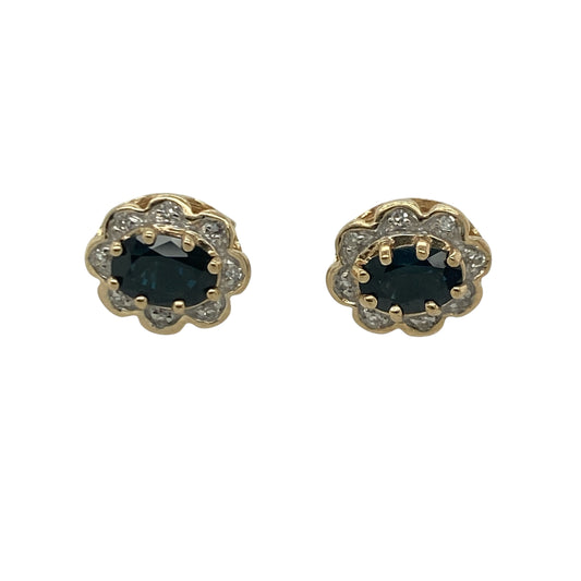Add timeless elegance and vibrant colour to your jewellery collection with these pre-owned 9ct yellow gold diamond and sapphire cluster stud earrings, featuring a classic gemstone design with sophisticated everyday appeal—perfect for special occasions, gifting, or refined daily wear.
Design: The earrings showcase beautiful oval sapphire gemstones, each measuring approximately 6mm by 4mm, surrounded by sparkling diamond accents in an elegant cluster setting.