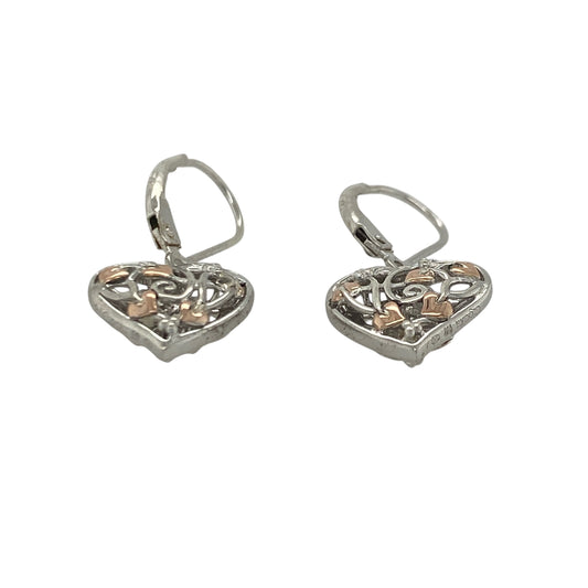 Add a touch of Welsh-inspired magic and symbolic elegance to your jewellery collection with these pre-owned sterling silver and 9ct rose gold Clogau Tree of Life Fairy Heart drop earrings, featuring a beautifully detailed design with timeless appeal—perfect for gifting, special occasions, or refined everyday wear.
Design: The earrings showcase an enchanting Fairy Heart design incorporating the iconic Tree of Life motif, creating a graceful and eye-catching look.