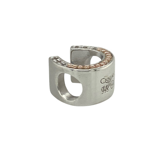 Add a touch of Welsh-inspired elegance and symbolic charm to your jewellery collection with this pre-owned sterling silver, 9ct rose gold and white topaz Clogau horseshoe charm, featuring a meaningful design with timeless appeal—perfect for gifting, collecting, or adding to a favourite charm bracelet.
Design: The charm showcases a beautifully crafted horseshoe motif, enhanced with sparkling white topaz accents that add brilliance and sophistication to the design.