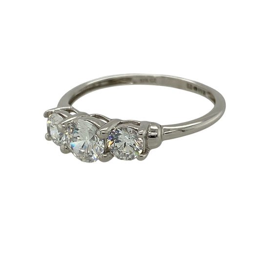 Add timeless sparkle to your jewellery collection with this pre-owned 9ct white gold cubic zirconia trilogy ring, featuring three dazzling stones in a classic trilogy design—perfect for everyday elegance or a meaningful gift.
Design: The ring showcases a brilliant round cubic zirconia centre stone measuring approximately 5mm in diameter, flanked by two matching round cubic zirconia stones measuring approximately 4mm each.