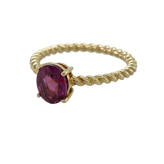 Add a touch of feminine elegance to your jewellery collection with this pre-owned 9ct yellow gold pink tourmaline ring, featuring a vibrant oval gemstone and a beautifully twisted band for a distinctive finish.
Design: The ring showcases a stunning oval pink tourmaline measuring approximately 8mm by 6mm, creating a vibrant focal point. The gemstone is complemented by an elegant twisted band, adding texture and unique character to the classic solitaire design.