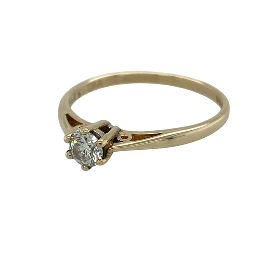 Celebrate timeless elegance with this pre-owned 9ct yellow gold diamond solitaire ring, featuring a sparkling brilliant-cut diamond in a classic setting that never goes out of style.
Design: The ring showcases a beautiful brilliant-cut diamond weighing approximately 0.25ct, presented in a classic solitaire setting that allows the diamond to take centre stage. Its simple yet elegant design makes it a versatile choice, perfect for everyday wear or life's most special occasions.