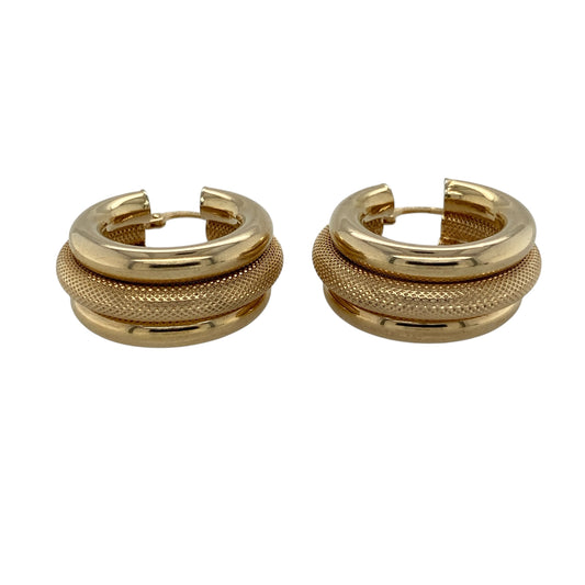 Add bold style and distinctive texture to your jewellery collection with these pre-owned 9ct yellow gold three-band wide hoop creole earrings, featuring a substantial design with contrasting polished and textured finishes.
Design: These eye-catching creole earrings feature a wide three-band design, with a textured centre section positioned between two plain polished bands. The contrasting finishes create depth and visual interest while maintaining the timeless appeal of classic gold hoop earrings.