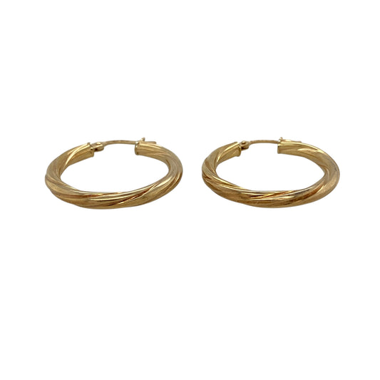 Add timeless style and elegant texture to your jewellery collection with these pre-owned 9ct yellow gold twisted hoop creole earrings, featuring a classic design enhanced by distinctive decorative detailing.
Design: These stylish creole earrings showcase a twisted hoop design that adds depth, texture and visual interest to the traditional circular silhouette.