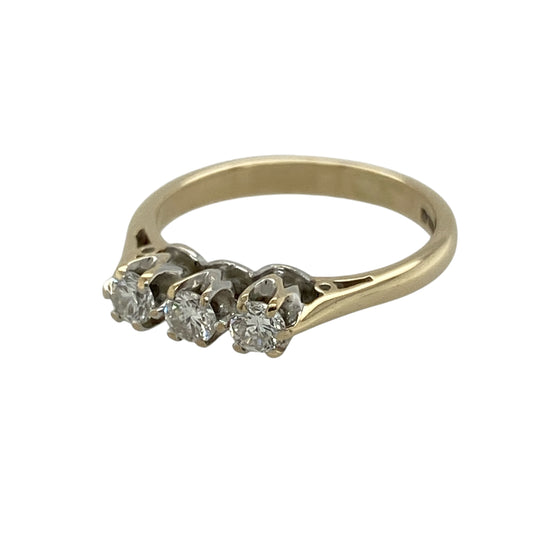 Celebrate timeless elegance and meaningful symbolism with this pre-owned 9ct yellow gold diamond trilogy ring, featuring three sparkling diamonds in a classic and sophisticated design.
Design: The ring showcases a traditional trilogy setting, with three diamonds arranged across the centre to represent the past, present and future. This timeless style offers a balanced and elegant appearance, making it a wonderful choice for everyday wear, anniversaries or special occasions.