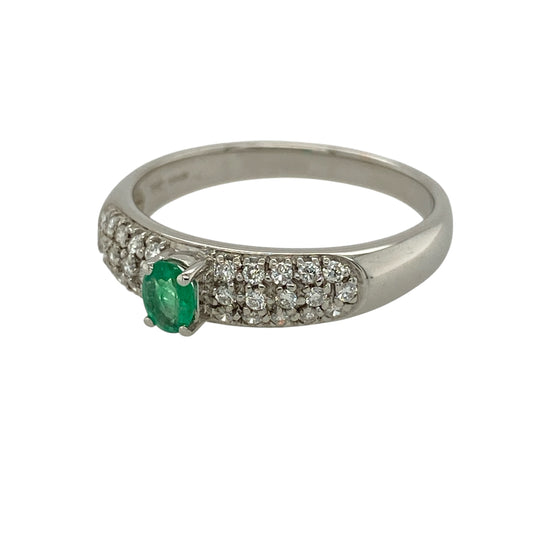 Add rich colour and refined sparkle to your fine jewellery collection with this pre-owned 18ct white gold diamond and emerald band ring, featuring an elegant oval emerald centre stone and sparkling pavé-set diamond shoulders.
Design: The ring showcases a beautiful oval emerald as its central focal point, complemented by diamond-set shoulders that extend the sparkle across the front of the band.