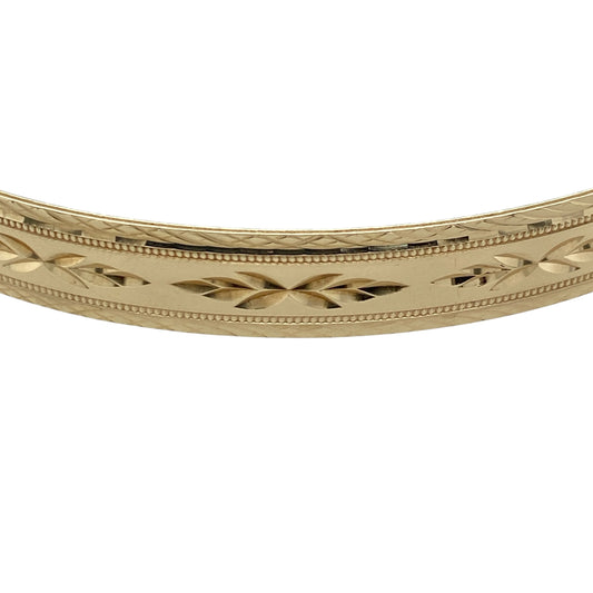 Add timeless elegance and distinctive decorative detail to your jewellery collection with this pre-owned 9ct yellow solid gold patterned bangle, featuring an attractive textured design with a substantial profile.
Design: The bangle showcases a classic profile enhanced with decorative patterning, creating texture, depth and visual interest while retaining a timeless and versatile appearance suitable for everyday wear or special occasions.