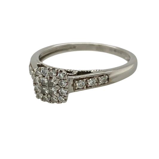 Add timeless elegance and exceptional sparkle to your jewellery collection with this pre-owned 9ct white gold diamond square cluster ring, featuring approximately 0.33ct of total diamond content in a beautifully balanced cluster design—perfect as an engagement ring, anniversary gift, or sophisticated everyday jewellery piece.
Design: The ring features a classic square diamond cluster, creating the appearance of a larger centre stone while delivering impressive brilliance and a timeless, elegant look.