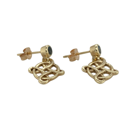 These pre-owned 9ct yellow gold Celtic knot drop earrings feature vibrant blue topaz gemstones, combining timeless Celtic styling with a touch of colour for an elegant everyday look.
Design: Each earring showcases an intricate Celtic knot design suspended beneath a sparkling round blue topaz, creating graceful movement and a classic finish. Their timeless style makes them perfect for both everyday wear and special occasions.
Material: Made from 9-carat yellow gold with blue topaz gemstones.