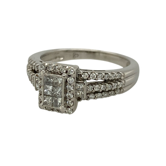 This pre-owned 18ct white gold diamond rectangle cluster ring is an elegant statement piece, beautifully combining brilliant and princess cut diamonds in a timeless design.
Design: The ring features a striking rectangular cluster with a mix of brilliant and princess cut diamonds, creating a captivating display of sparkle and depth. Set in polished 18-carat white gold, it is a sophisticated piece that's perfect for both everyday wear and special occasions.