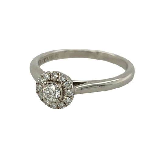 This pre-owned 18ct white gold diamond halo ring is a timeless design, featuring a sparkling brilliant cut centre diamond surrounded by a halo of smaller diamonds.
Design: The ring showcases a brilliant cut centre diamond framed by a delicate halo of diamonds, enhancing its size and brilliance. The polished 18-carat white gold setting gives this elegant ring a classic look that is perfect for everyday wear or special occasions.
Material: Made from 18-carat white gold.