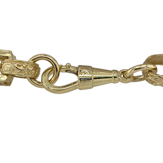 This pre-owned 9ct yellow gold gypsy style belcher and bar bracelet combines bold patterned links with cubic zirconia accents for a distinctive statement look.
Design: Featuring a classic belcher and bar link design with decorative patterned gypsy style links, this substantial bracelet is accented with cubic zirconia stones for added detail. Its generous 8-inch length and bold 8mm wide links make it an eye-catching piece for everyday wear or special occasions.
Material: Made from 9-carat yellow gold.