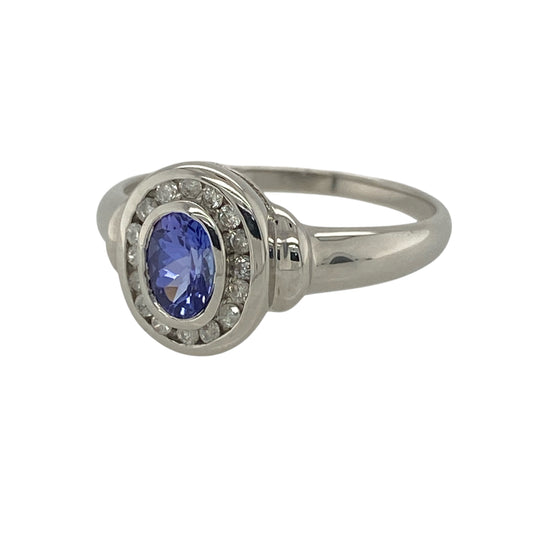 This pre-owned 9ct white gold diamond and tanzanite cluster ring is a timeless design, beautifully showcasing the rich violet-blue tones of tanzanite with sparkling diamond accents.
Design: Featuring an elegant oval tanzanite at its centre, this classic cluster ring is surrounded by shimmering diamonds that enhance the brilliance and colour of the gemstone. The cool white gold setting perfectly complements the vibrant tanzanite, making it a stunning choice for both everyday wear and special occasions.