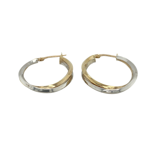 This pair of pre-owned 9ct yellow and white gold double oval twist creole earrings offers a timeless two-tone design with elegant contemporary styling.
Design: Featuring two intertwined oval hoops in contrasting yellow and white gold, these creole earrings create a beautiful twisted effect that catches the light from every angle. Their polished finish and versatile design make them perfect for everyday wear or adding a touch of sophistication to special occasions.