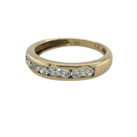 This pre-owned 9ct yellow gold cubic zirconia band ring is a classic design, featuring sparkling stones across the front for an elegant finish.
Design: Featuring cubic zirconias set across the front of the yellow gold band, this ring offers a timeless gemstone-set look that can be worn alone or alongside other rings.
Material: Made from 9-carat yellow gold.
Gemstone Detail: Set with cubic zirconia stones.
Ring Detail: Front of the band measures approximately 4mm wide.