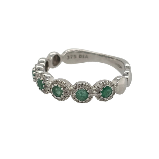 New 9ct White Gold Diamond & Emerald Flower Band Ring in various sizes with the approx weight 2.40 grams. There is approximatley 0.20ct of diamond content in the ring has approximate clarity i2-i3 and colour H - I